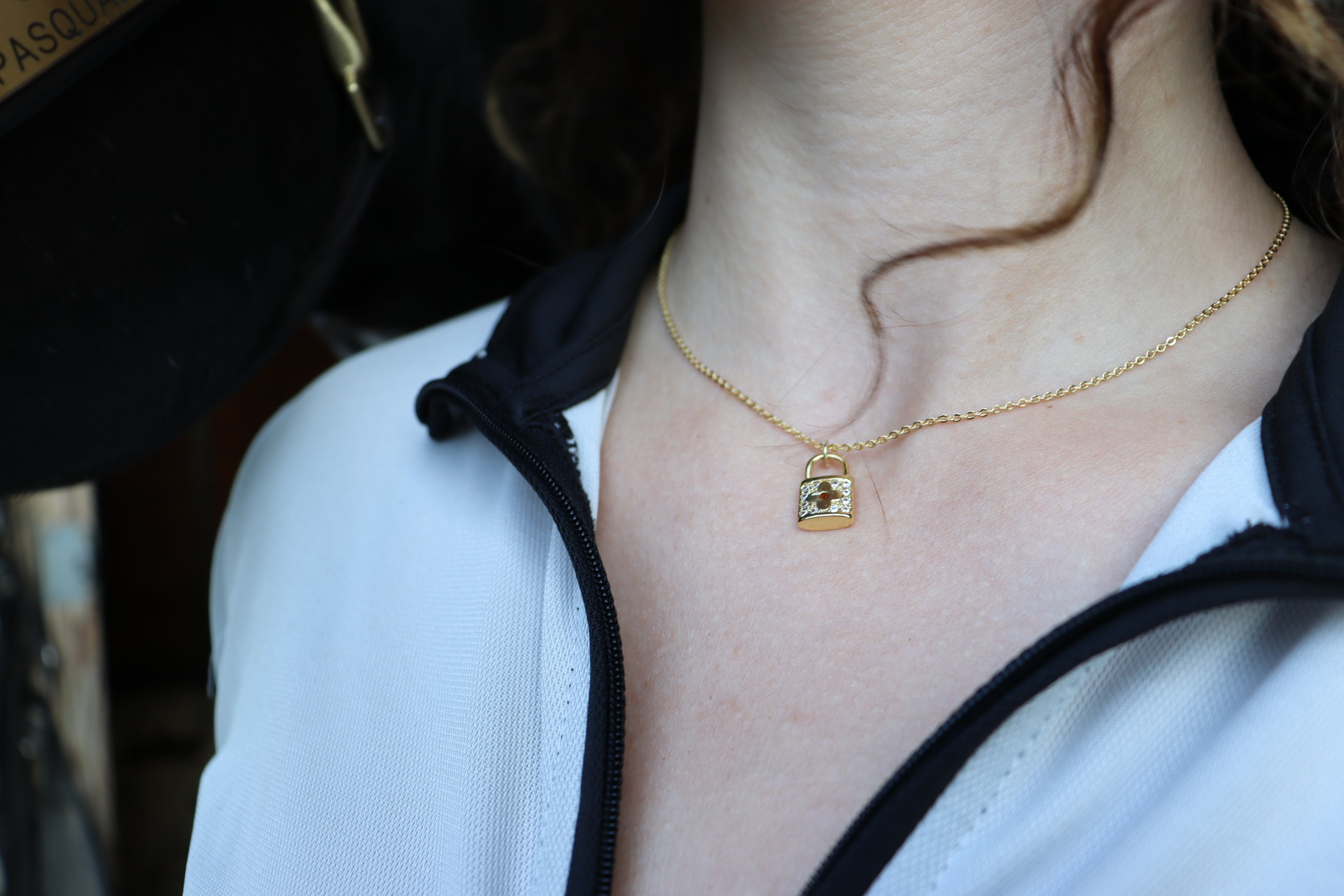 lock necklace on girl's neck
